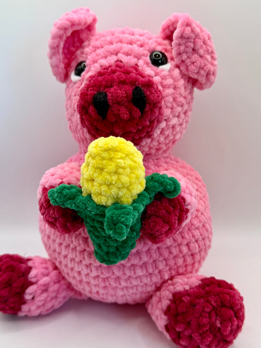 Crochet pig with a head of corn